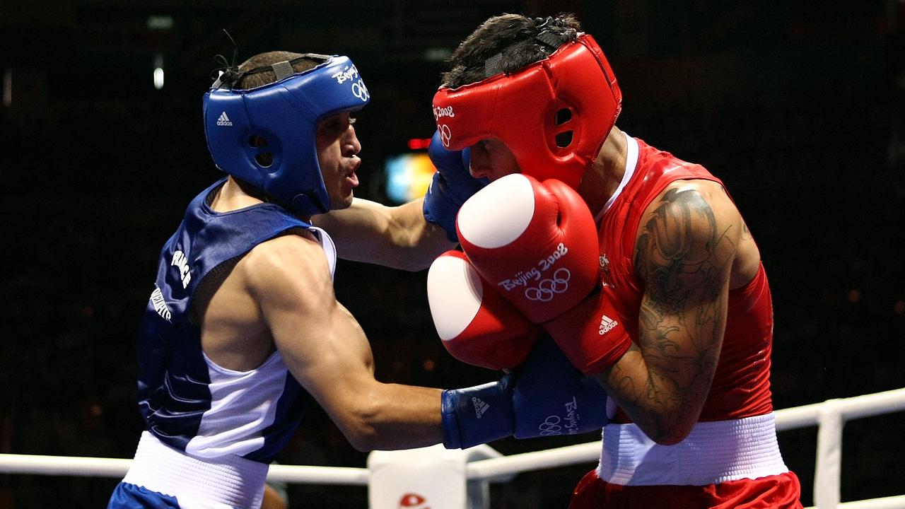 Khedafi Djelkhir (L) of France competes Paul Fleming of Australia at the Beijing Olympics.