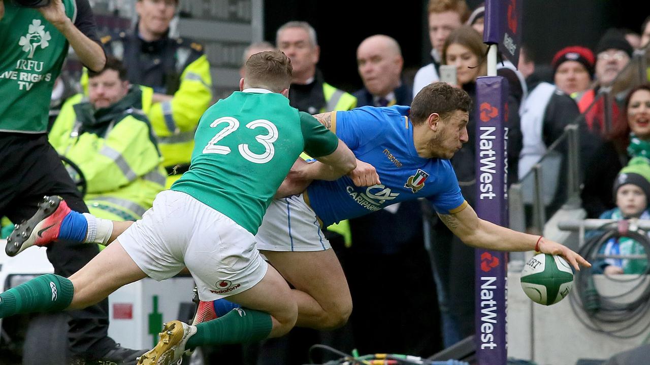 Italy fullback Matteo Minozzi scores during the Six Nations at the Aviva Stadium in Dublin.