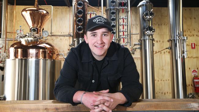 Luke with his slew of spirit making equipment. Picture Glenn Hampson