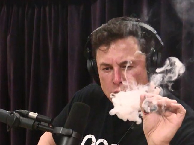 Unwise. Tesla founder Elon Musk smokes a joint on the Joe Rogan Experience podcast.