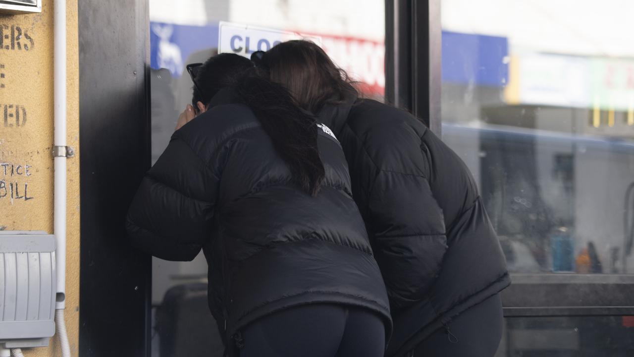 Locals scope the scene after the police tape is removed. Picture: NCA NewsWire / Monique Harmer