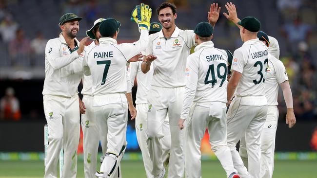 Australian quick Mitchell Starc is congratulated by teammates after dismissing New Zealand’s Neil Wagner. Picture: AAP