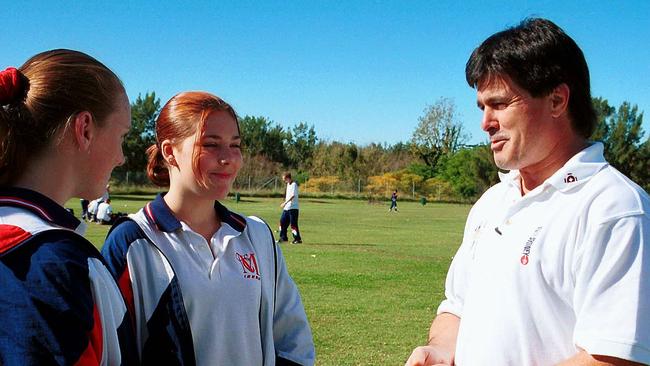 End of an era: a look back at McCarthy Catholic College: Former Eels footy player, Graeme Atkins, with two McCarthy students, Desiree Celeban, and Elise Lockhart in 2001. Picture: Nick Andrean