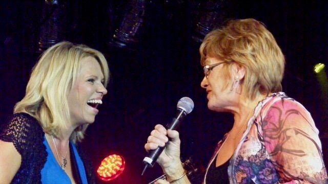 Beccy Cole and her mum Carole Sturtzel on stage.