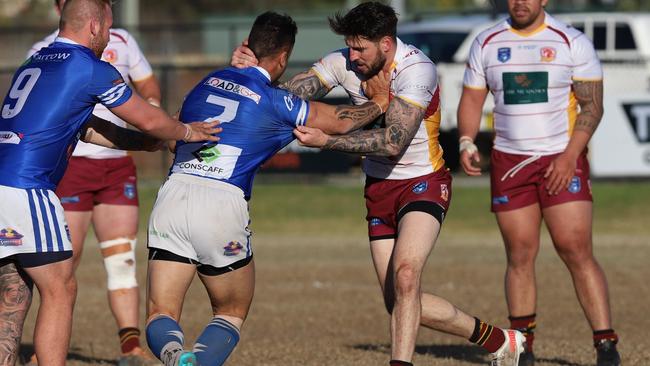 Thirlmere's Curtis Scott tackles Narellan’s Levi Dodd. Picture: Steve Montgomery