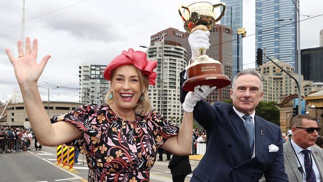 MELBOURNE . 31/10/2022.  RACING.  Lexus Melbourne Cup Parade up St Kilda rd to Federation Square. Lord Mayor Sally Capp and Victoria Racing Club chairman Neil Wilson with the cup in Federation Square    . Picture by Michael Klein