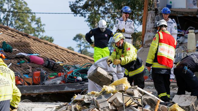 Emergency services work to clear debris in the search for a missing woman at the site of an exploded home at Waikanda Crescent, in the Western Sydney suburb of Whalan. Picture: NewsWire / Max Mason-Hubers