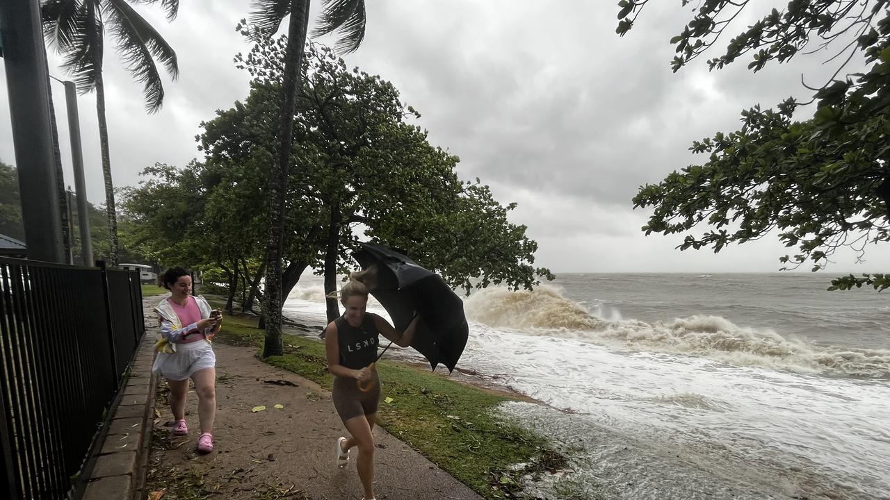 Trinity Beach locals battle the storm surge on Wednesday morning. Picture: Supplied