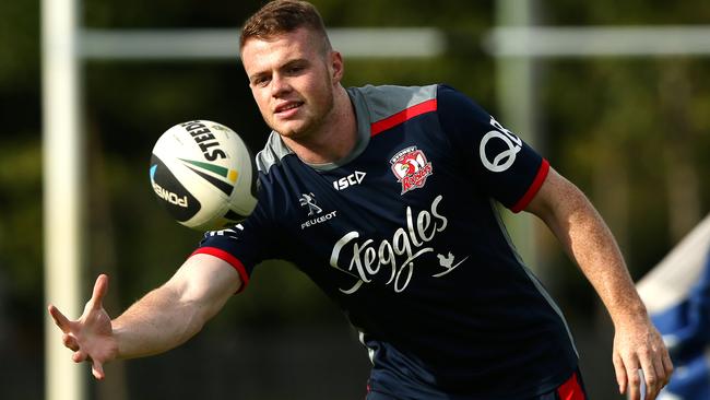 Joe Burgess takes a pass during Sydney Roosters training. Picture: Gregg Porteous