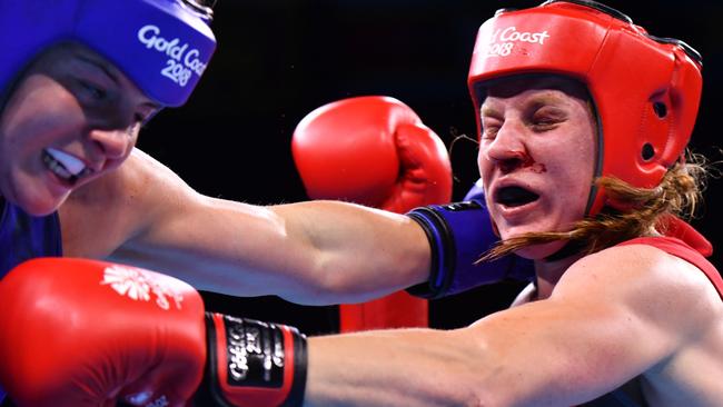 Northern Ireland's Michaela Walsh (in red) in battle with Australia's Skye Nicolson. Picture: Anthony Wallace