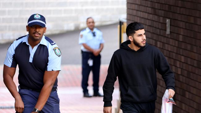 Dani Mansour (right) left Blacktown police station after making bail on charges riot, affray and destroy/damage property during public disorder. Picture: NCA NewsWire / Damian Shaw