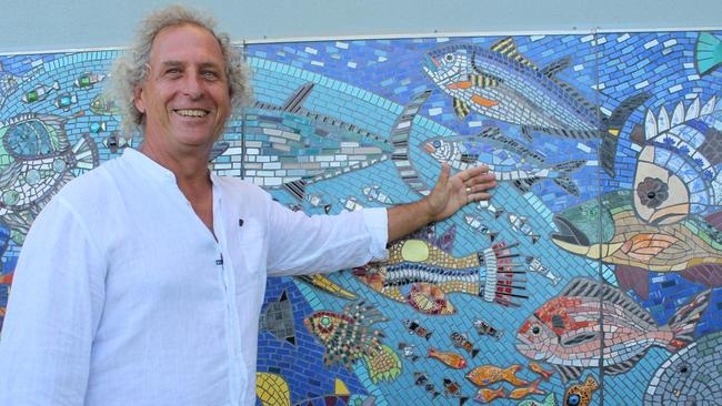 Paul Perry said his Milbi Magic Mosaic draws “busloads of people” from around Queensland to view the art installation wrapped around a toilet block on Archie's Beach.