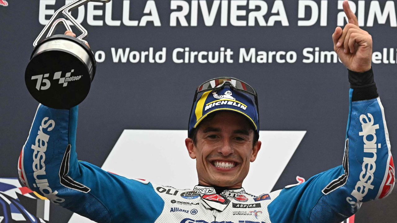 TOPSHOT - Gresini Racing MotoGP's Spanish rider Marc Marquez celebrates on the podium following the San Marino MotoGP at the Misano World Circuit Marco-Simoncelli in Misano Adriatico on September 8, 2024. (Photo by Gabriel BOUYS / AFP)