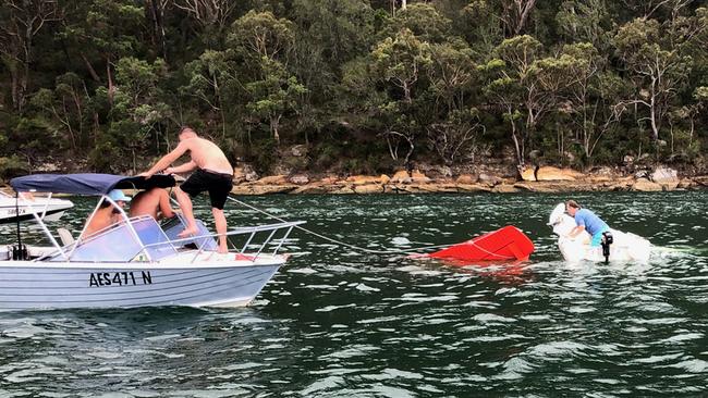 Will McGovern, Lachlan Hewitt, Todd Sellars and Kurt Bratby joined efforts to rescue those aboard the sinking seaplane on Sunday. Picture: Todd Sellars