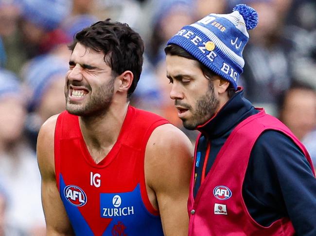 MELBOURNE, AUSTRALIA - JUNE 10: Christian Petracca of the Demons leaves the field injured during the 2024 AFL Round 13 match between the Collingwood Magpies and the Melbourne Demons at The Melbourne Cricket Ground on June 10, 2024 in Melbourne, Australia. (Photo by Dylan Burns/AFL Photos via Getty Images)