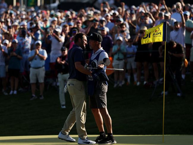 Scottie Scheffler celebrates with his caddie, Ted Scott, after winning the 2025 PGA Championship. Picture: Warren Little/Getty Images