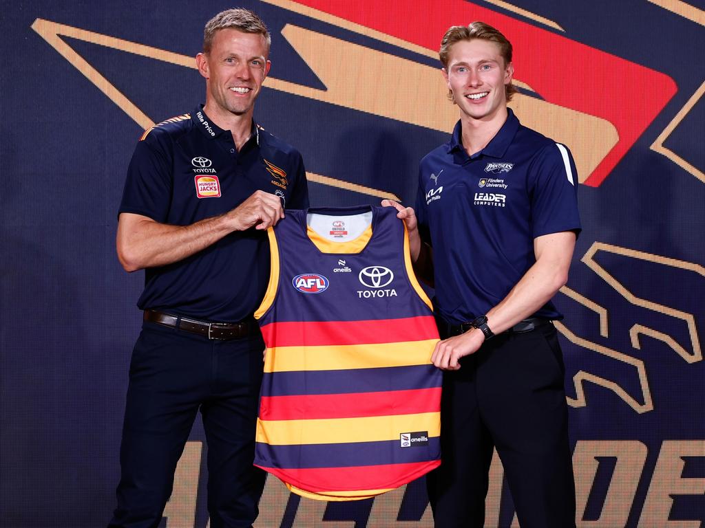 Draper gets his Adelaide jumper from former skipper Nathan Van Berlo. Picture: Michael Willson/AFL Photos