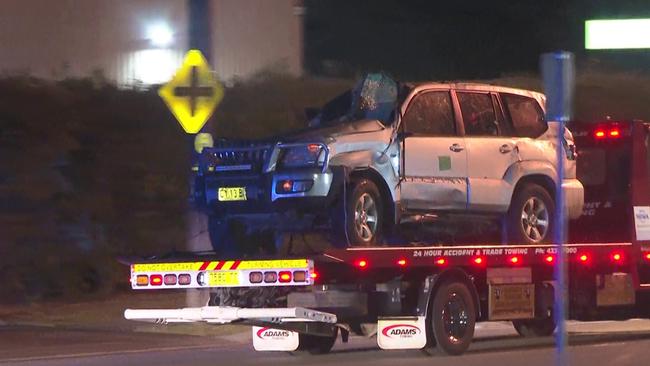 A badly damaged 4WD is towed away from the scene. Picture: TNV