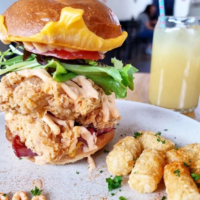 A huge burger from the feed of Adelaide blogger Tempting Palates. Picture: Instagram/@temptingpalates