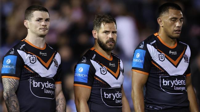 SYDNEY, AUSTRALIA - JULY 12:  John Bateman and Aidan Sezer of the Wests Tigers react after a Sharks try during the round 19 NRL match between Cronulla Sharks and Wests Tigers at PointsBet Stadium on July 12, 2024, in Sydney, Australia. (Photo by Brendon Thorne/Getty Images)