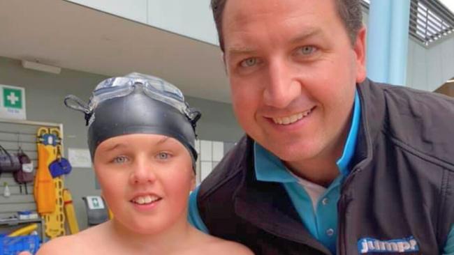 Swim teacher James Bradley with his son, Dan. Image: supplied