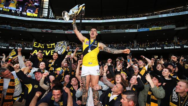 Dustin Martin celebrates with the premiership cup. Picture. Phil Hillyard