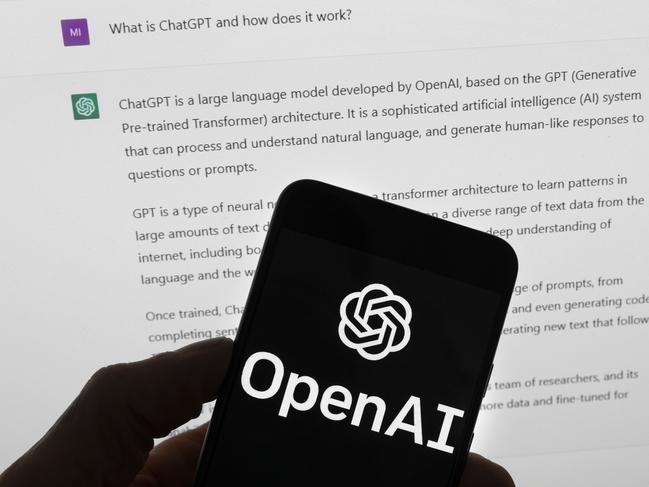 FILE - The OpenAI logo is seen on a mobile phone in front of a computer screen which displays output from ChatGPT, March 21, 2023, in Boston. (AP Photo/Michael Dwyer, File)