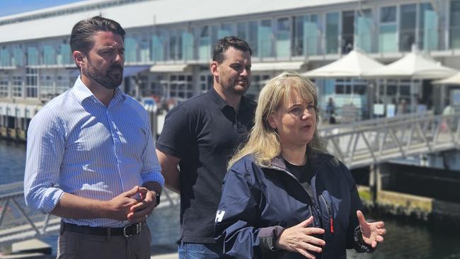 Liberal Senator Jonno Duniam, Environment Minister Madeleine Ogilvie and Salmon Tasmania CEO Luke Martin speak to the media on the Hobart waterfront on Thursday, January 9, 2025.