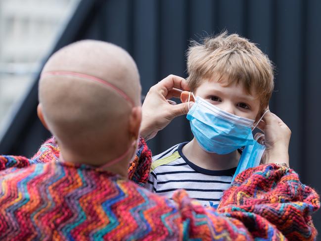 A child dons a mask during Victoria’s Covid bans. Picture: Jason Edwards