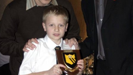 A young Jason Cummings receiving an award while playing football for Hutchison Vale in Edinburgh, Scotland. Photo: Supplied.