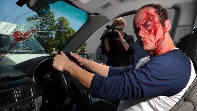Actor Mike Duncan wearing bloodied make-up for a MAC road-safety ad.