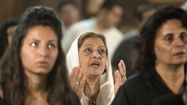 Relatives and friends of the cabin crew and passengers, who were on board the EgyptAir plane that crashed in the Mediterranean, attend a mourning ceremony. Picture: AFP