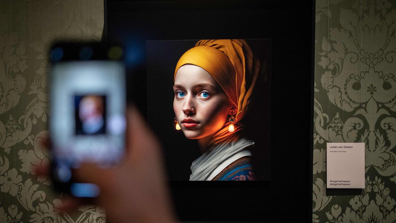 Berlin-based digital creator Julian van Dieke’s ‘Girl with a Pearl Earring’ on show at the Mauritshuis museum in The Hague. Julian van Dieken's work made using artificial intelligence (AI) is part of the special installation of fans' recreations of Johannes Vermeer's painting "Girl with a Pearl Earring" on display at the Mauritshuis museum. Picture: Simon Wohlfahr