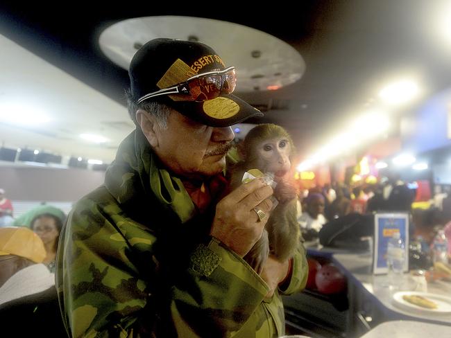 Johnny Colunga feeds his pet monkey Prince as they take refuge in the Max Bowl, which was converted to a shelter for those displaced by flooding from Tropical Storm Harvey in Port Arthur, Texas, Wednesday, Aug. 30, 2017 Picture: AP