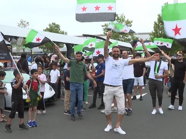 Scenes of jubilation in Chullora this afternoon after Syrian Rebels force regime change in Syria. Picture: TNV