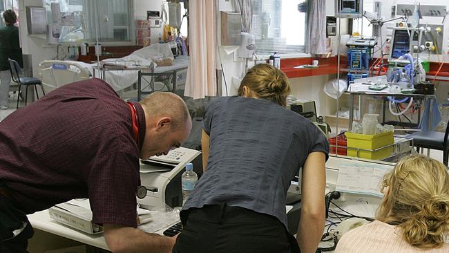 Staff at work in the ICU of the Royal Hobart Hospital.