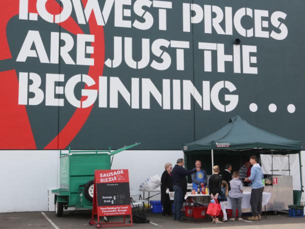 This is a story about why the weekend Bunnings sausage sizzles being so popular in the community. Today at Bunnings Hoxton Park, Rotary Club of Liverpool Greenway is manning the tongs and serving up the simple sausage on a sanga to visitors. pICS iAN sVEGOVIC