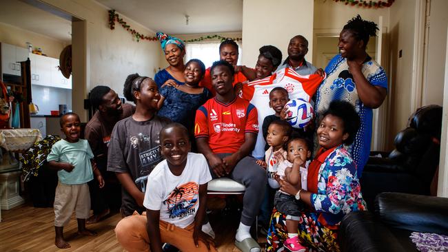 Nestory Irankunda with family at home in Adelaide. Picture: Matt Turner.