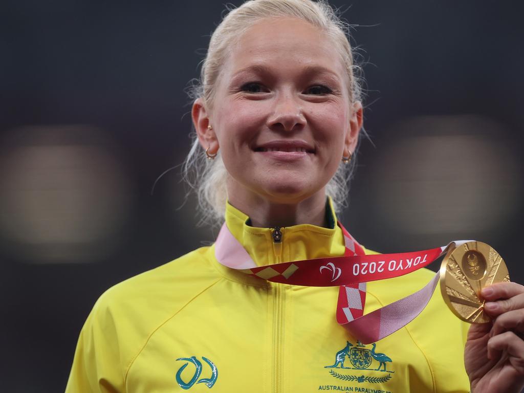 Vanessa Low of Team Australia celebrates with the gold medal. Photo by Alex Pantling/Getty Images.