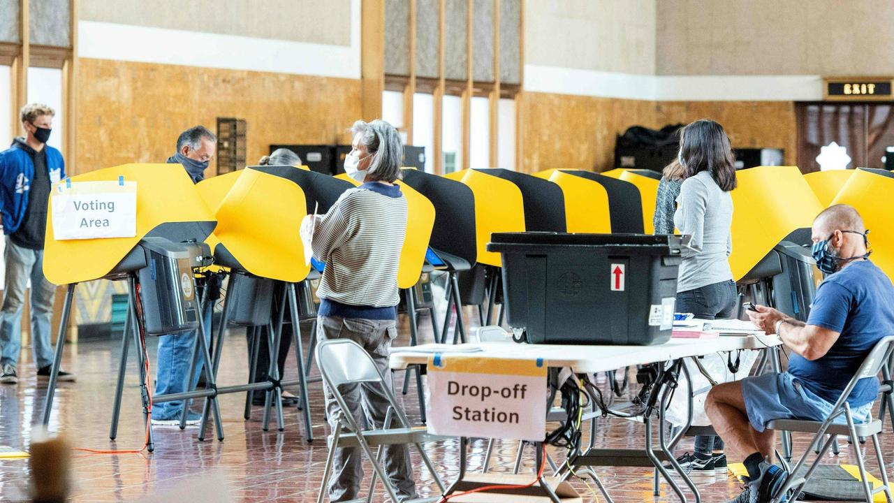 People cast their ballots on the first day of early voting at the Union Station in Los Angeles, California, on October 24 2020. Picture: Valerie Macon / AFP