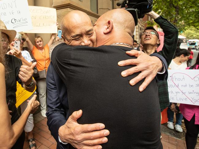 An emotional Dr Charlie Teo embraces a supporter.