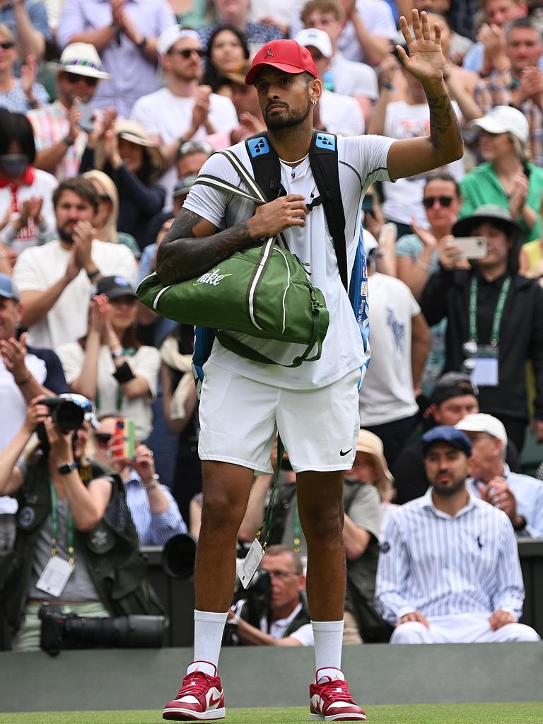 Nick Kyrgios breaks Wimbledon dress code, wearing red Nike shoes, hat ...