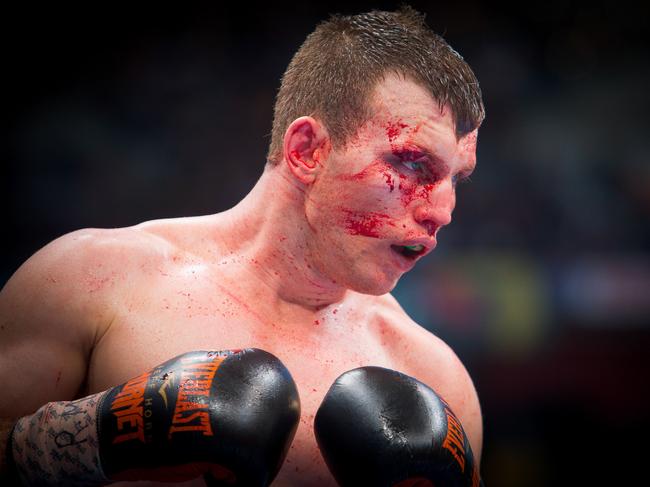 CORRECTION - Jeff Horn of Australia fights Manny Pacquiao of the Philippines during the World Boxing Organization boat at Suncorp Stadium in Brisbane on July 2, 2017.  / AFP PHOTO / Patrick HAMILTON / -- IMAGE RESTRICTED TO EDITORIAL USE - STRICTLY NO COMMERCIAL USE -- / “The erroneous mention[s] appearing in the metadata of this photo by Patrick HAMILTON has been modified in AFP systems in the following manner: [July 2] instead of [July 1]. Please immediately remove the erroneous mention[s] from all your online services and delete it (them) from your servers. If you have been authorized by AFP to distribute it (them) to third parties, please ensure that the same actions are carried out by them. Failure to promptly comply with these instructions will entail liability on your part for any continued or post notification usage. Therefore we thank you very much for all your attention and prompt action. We are sorry for the inconvenience this notification may cause and remain at your disposal for any further information you may require.”