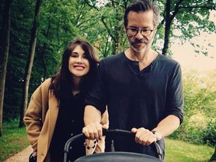 Guy Pearce and Carice van Houten take son Monte out for a walk.