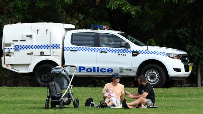 This week NSW Police officers patrolled inner-city parks to implore people to remain home. Picture: AAP/Joel Carrett