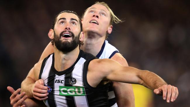 Brodie Grundy jostles with Mark Blicavs for position in the qualifying final. Picture: Michael Klein.