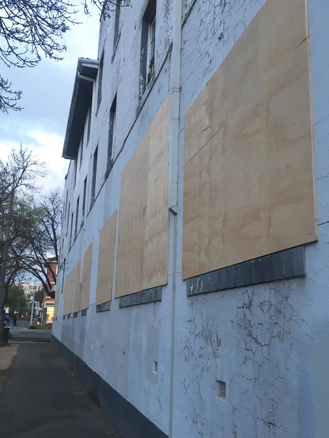 The Fitzroy St property is boarded up.