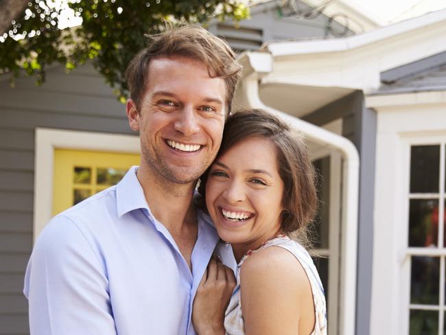 A couple who have just signed up a mortgage after buying their first house. Generic first home buyers Picture: iStock.