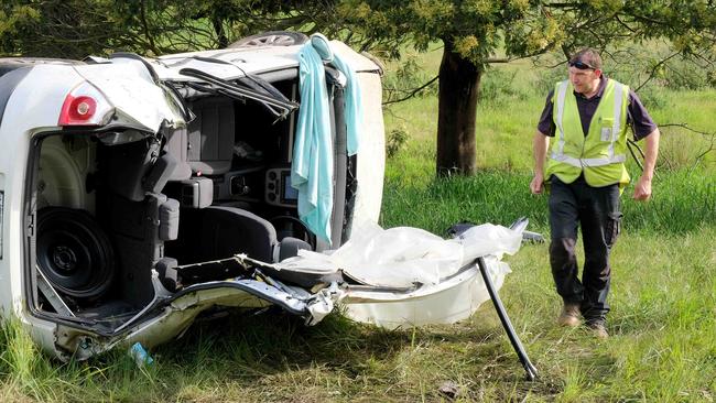 The car is inspected following the crash off Hunts Rd at Moriac. Picture: Mark Wilson