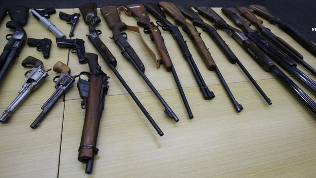 Police officers seized a large stash of guns during their raid of Jason Ross Maloney’s residences. Picture: NSW Police